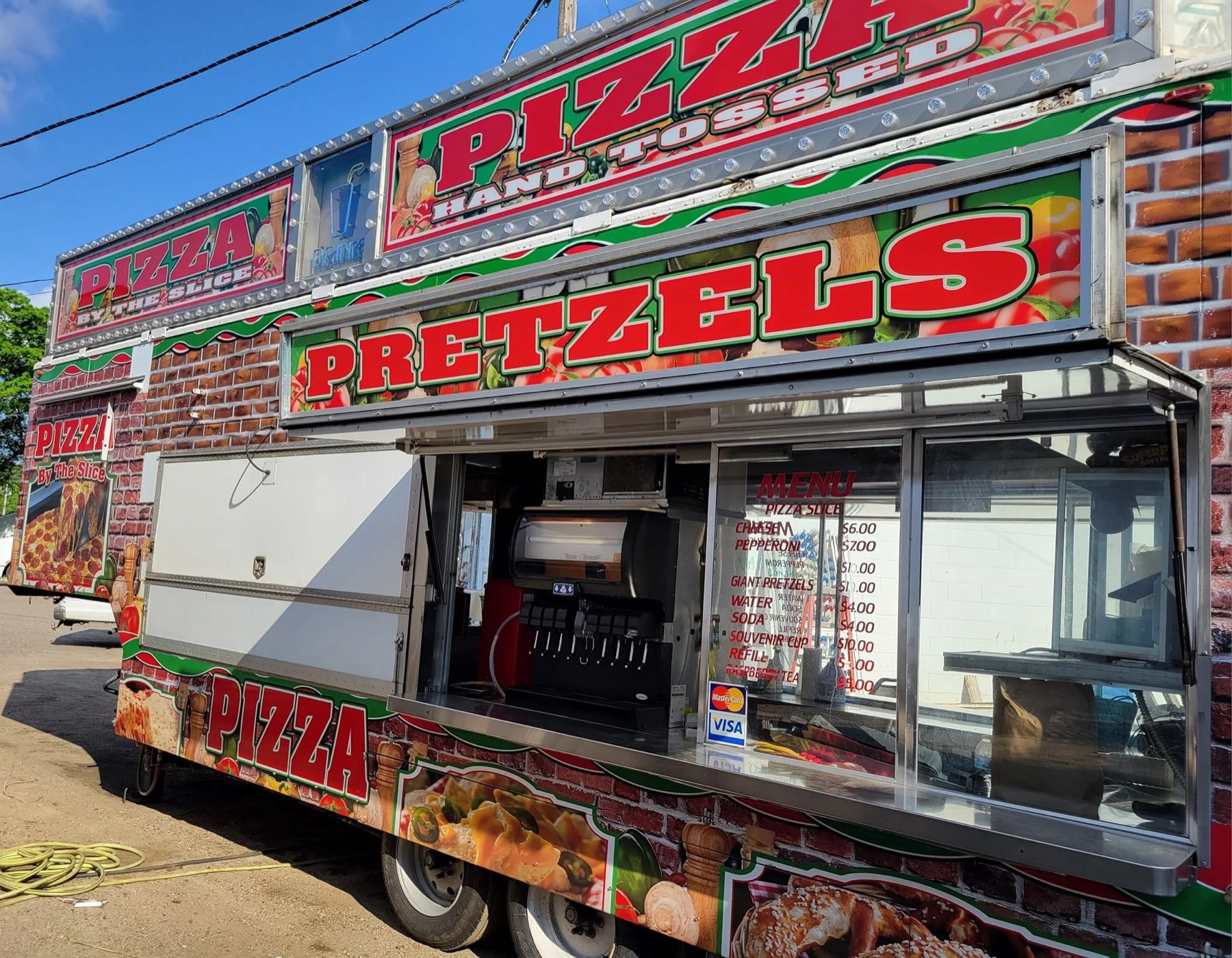Pizza and pretzels food truck with the fountain visible at the open window