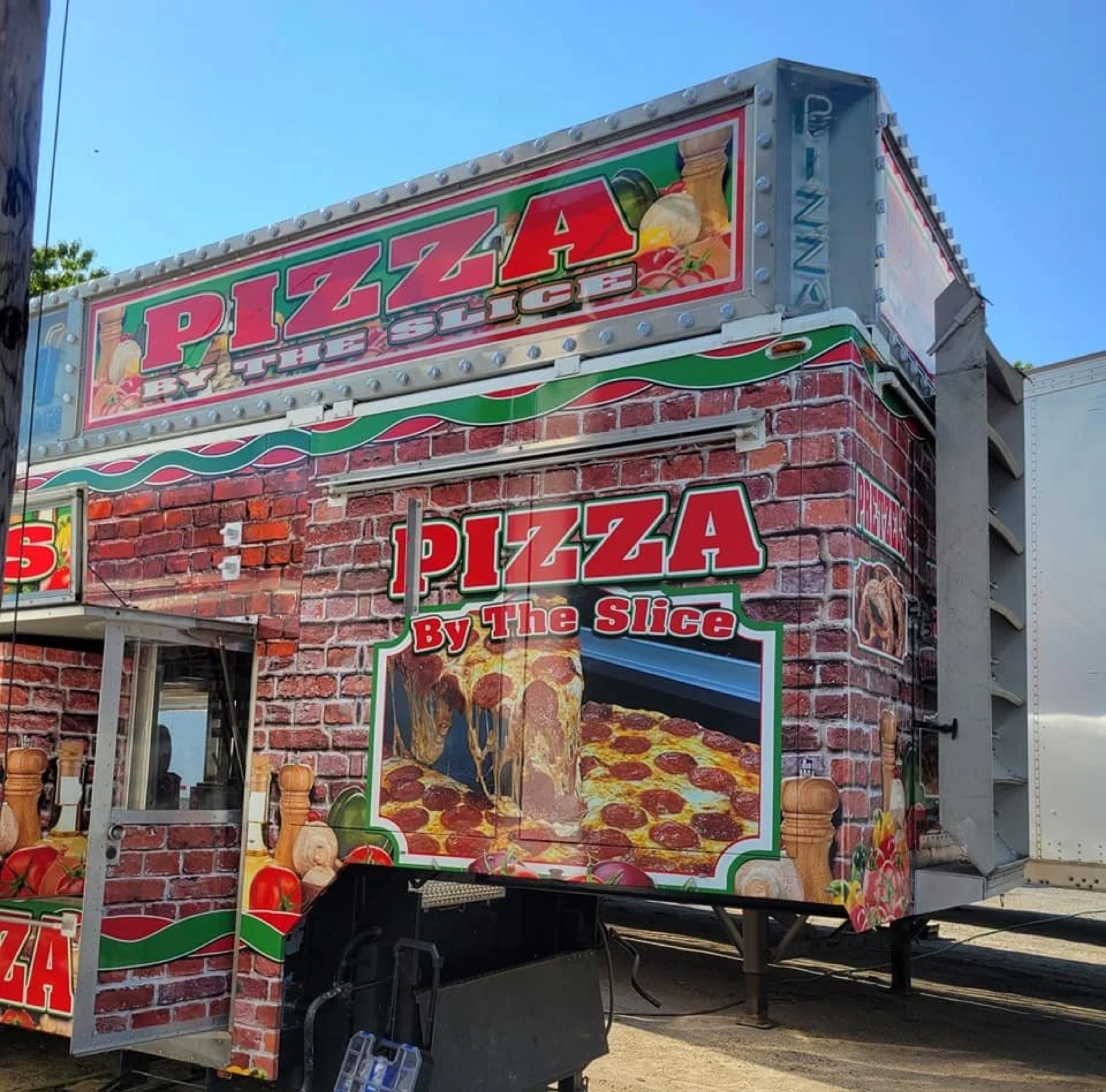 Exterior of the pizza-by-the-slice food truck after beverage install
